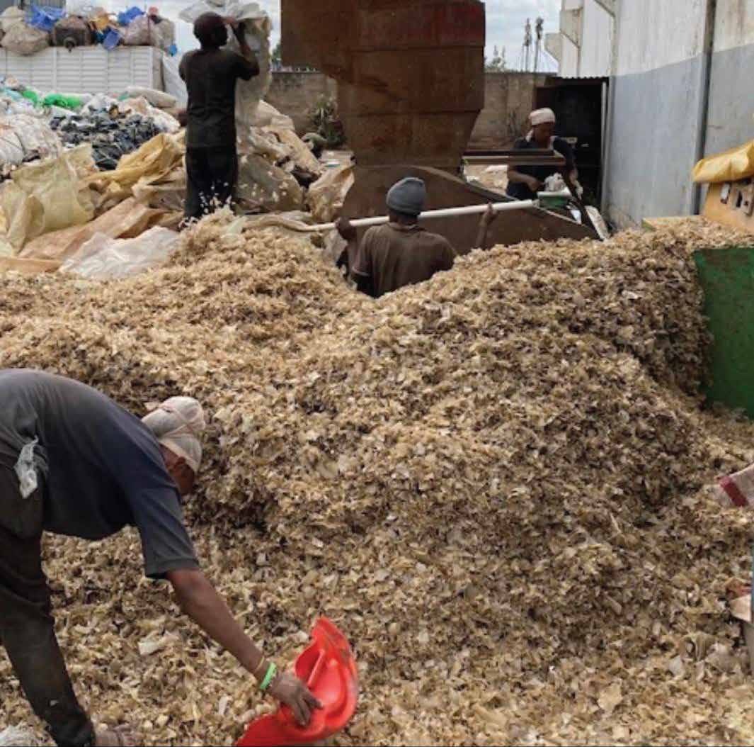 Team sorting recovered material by hand at the Tyna & Ruth Traders site
